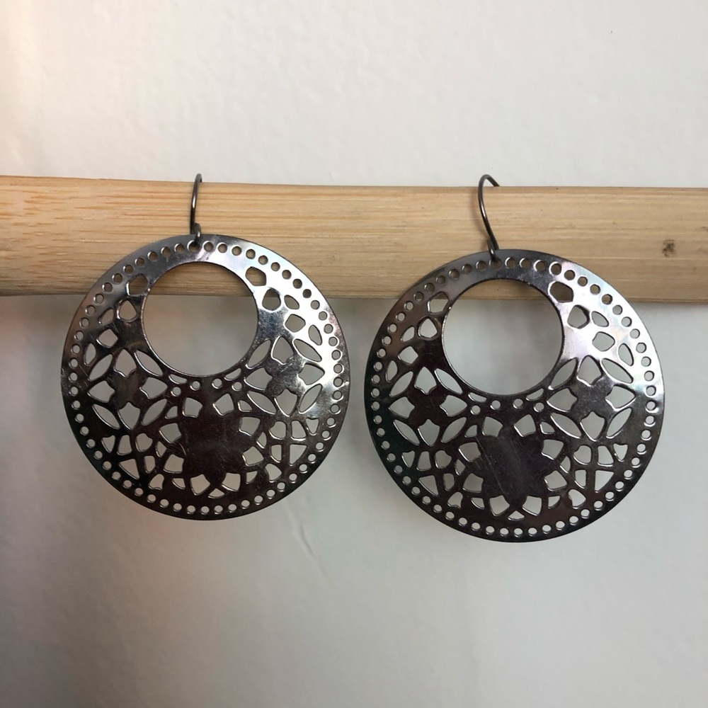 Silver circular laser-cut earrings